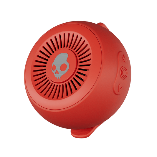 Red portable speaker with a skull design on a black background | Plasma
