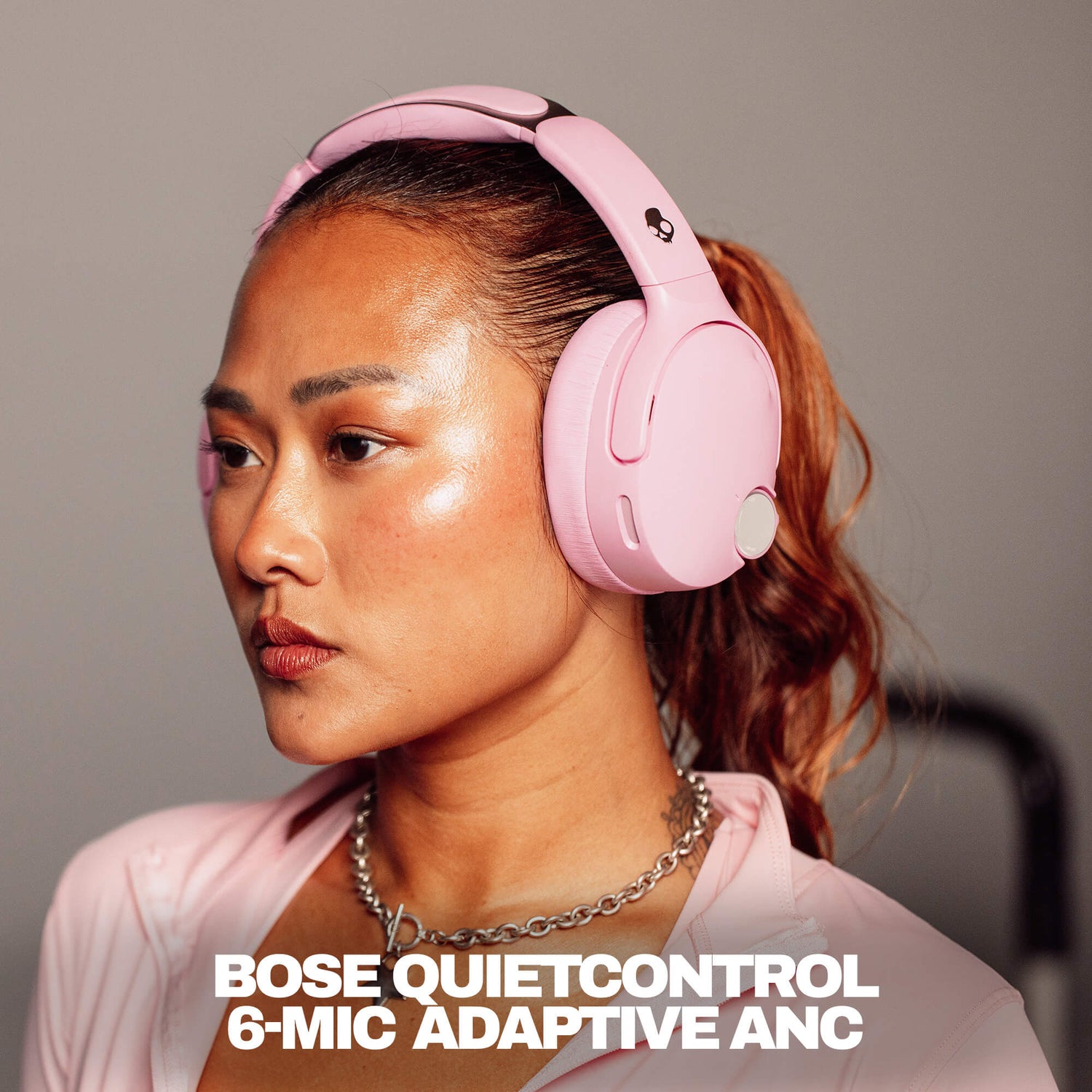 Woman wearing pink Bose QuietControl crusher 1080s with text overlay. | Candy