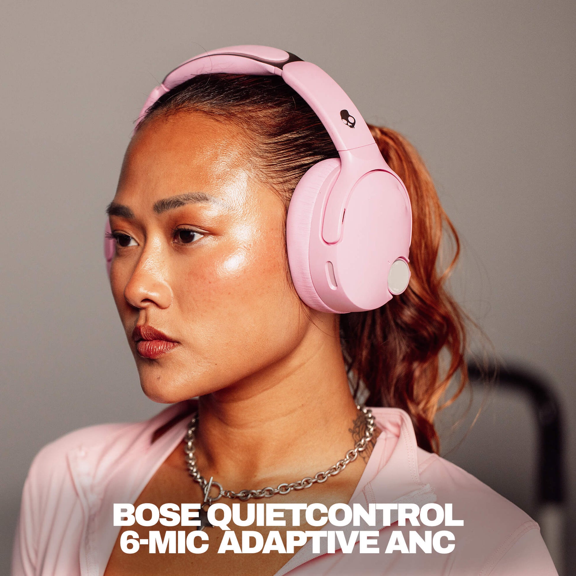 Woman wearing pink Bose QuietControl crusher 1080s with text overlay. | Candy