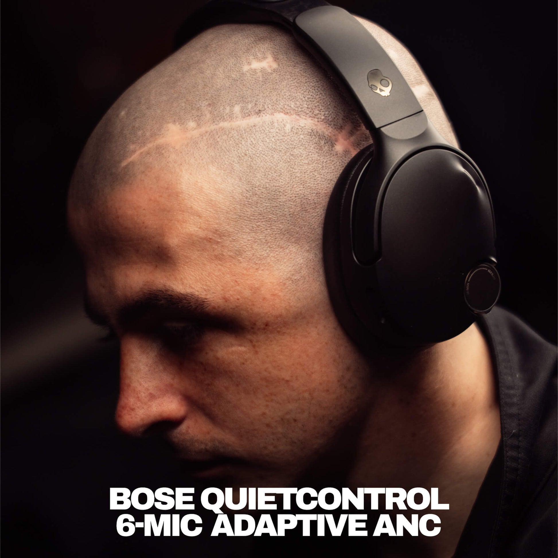Man wearing Bose QuietControl Crusher 1080 ANC with text indicating model details. | True Black