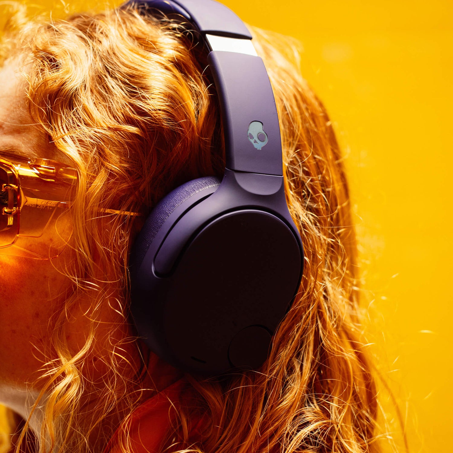Person wearing purple Crusher 720 with a skull logo on a bright yellow background | Future