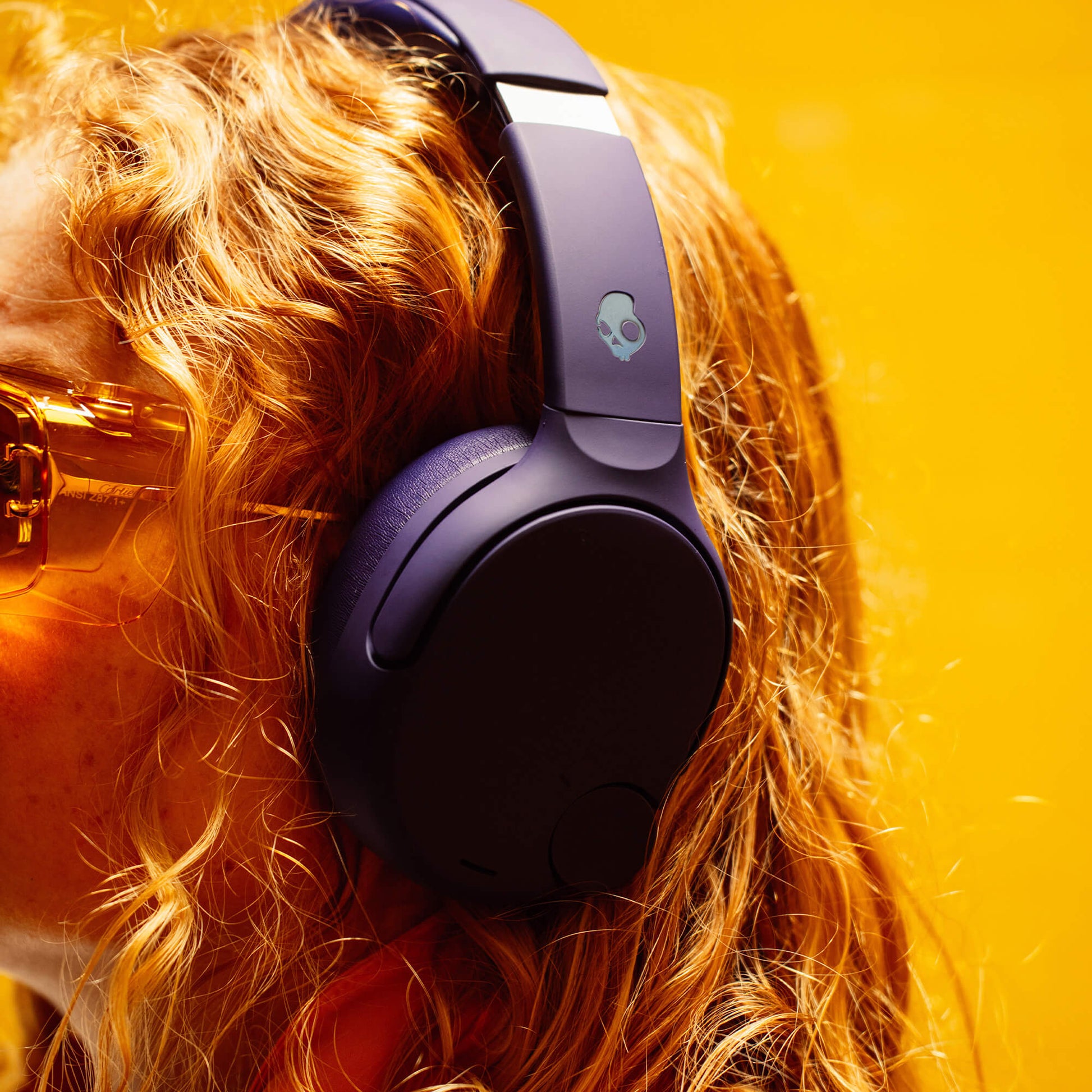 Person wearing purple Crusher 720 with a skull logo on a bright yellow background | Future