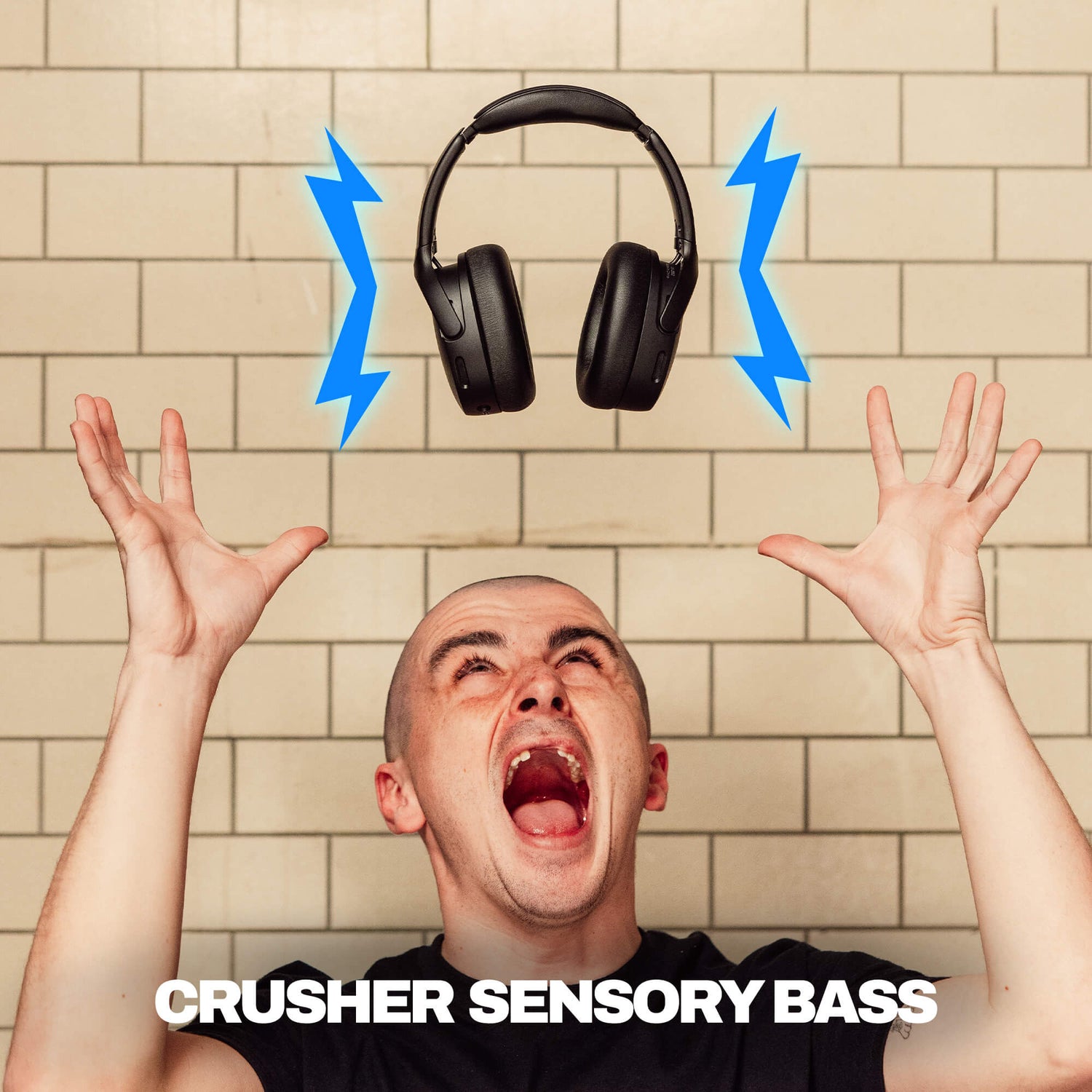 Person with raised hands and a pair of Crusher 720 headphones above, with 'Crusher Sensory Bass' text. | True Black