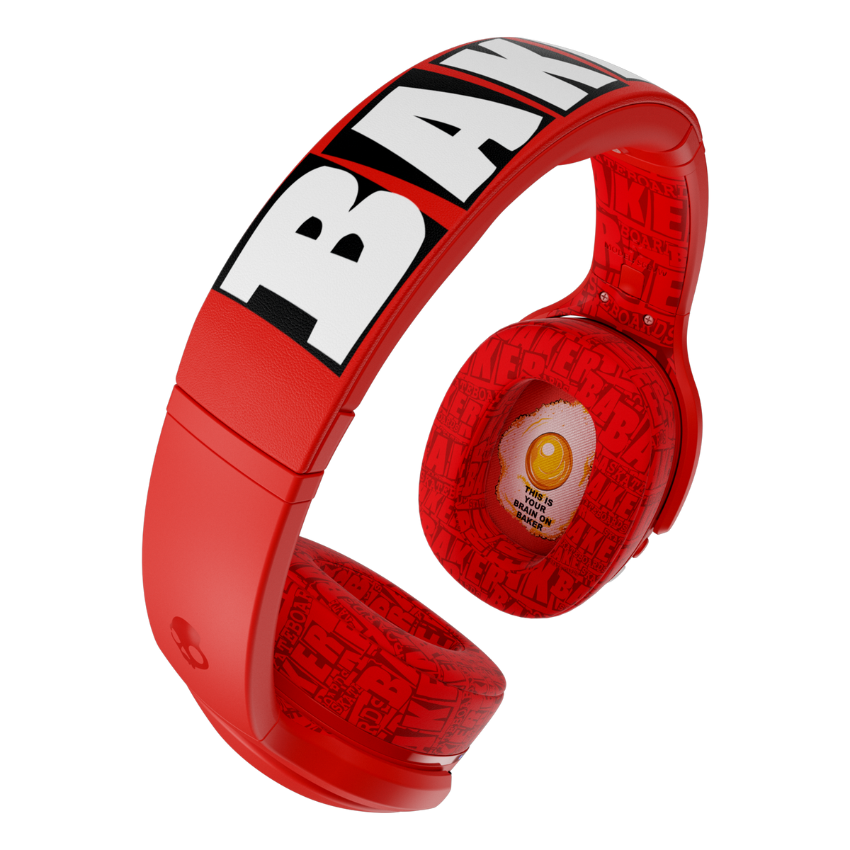 Red over-ear Crusher 540 active with bold white and black 'BANANA' lettering on the headband and a fried-egg graphic on the ear cup, shown on a plain white background. | Skullcandy X Baker Skateboards