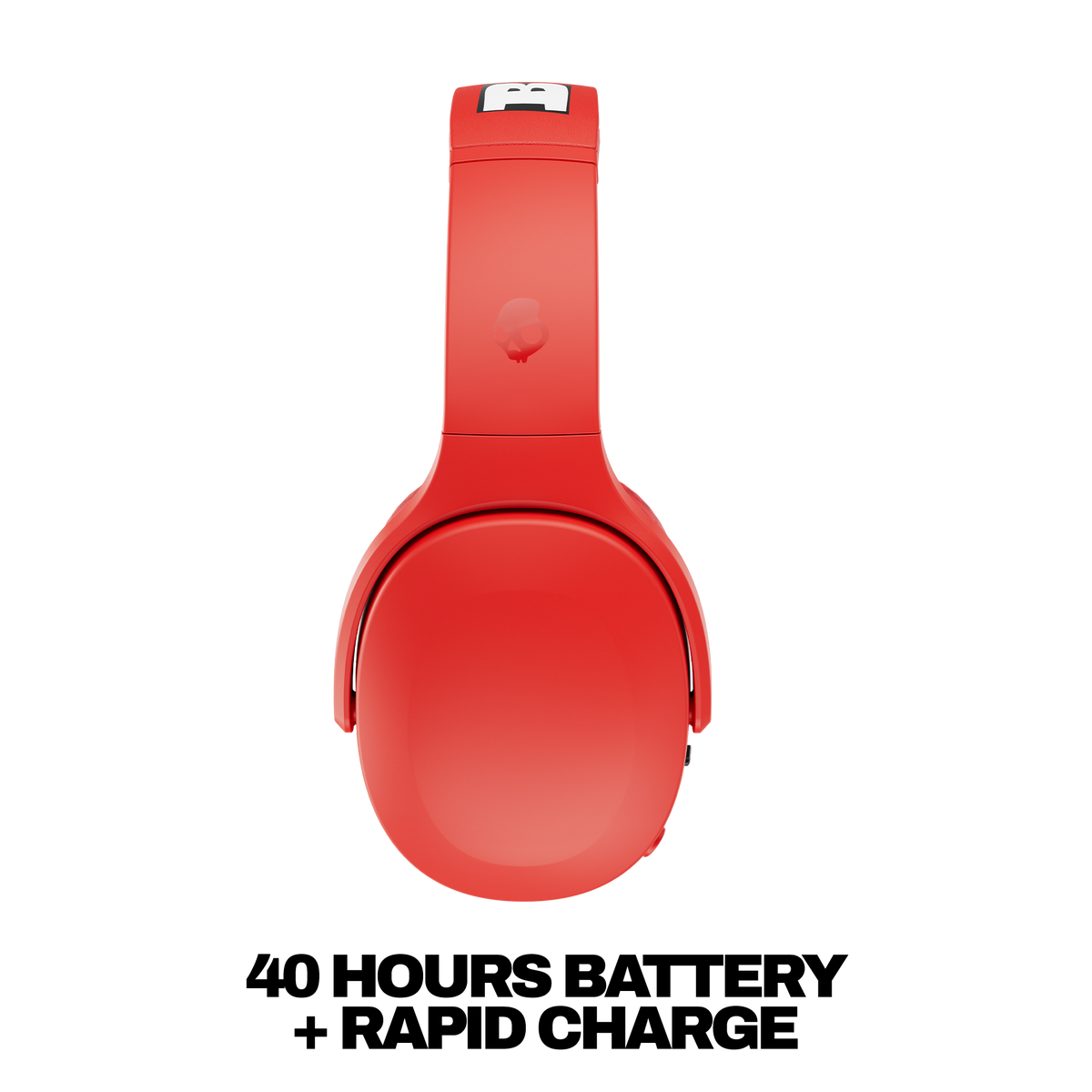 Red over-ear wireless headphones shown from a side view on a white background, with bold black text below reading '40 HOURS BATTERY + RAPID CHARGE'. | Skullcandy X Baker Skateboards