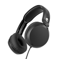 Black over-ear wired headphones with cushioned ear pads and a padded headband, shown at an angle on a solid black background. A small white skull logo is visible on the headband. | True Black