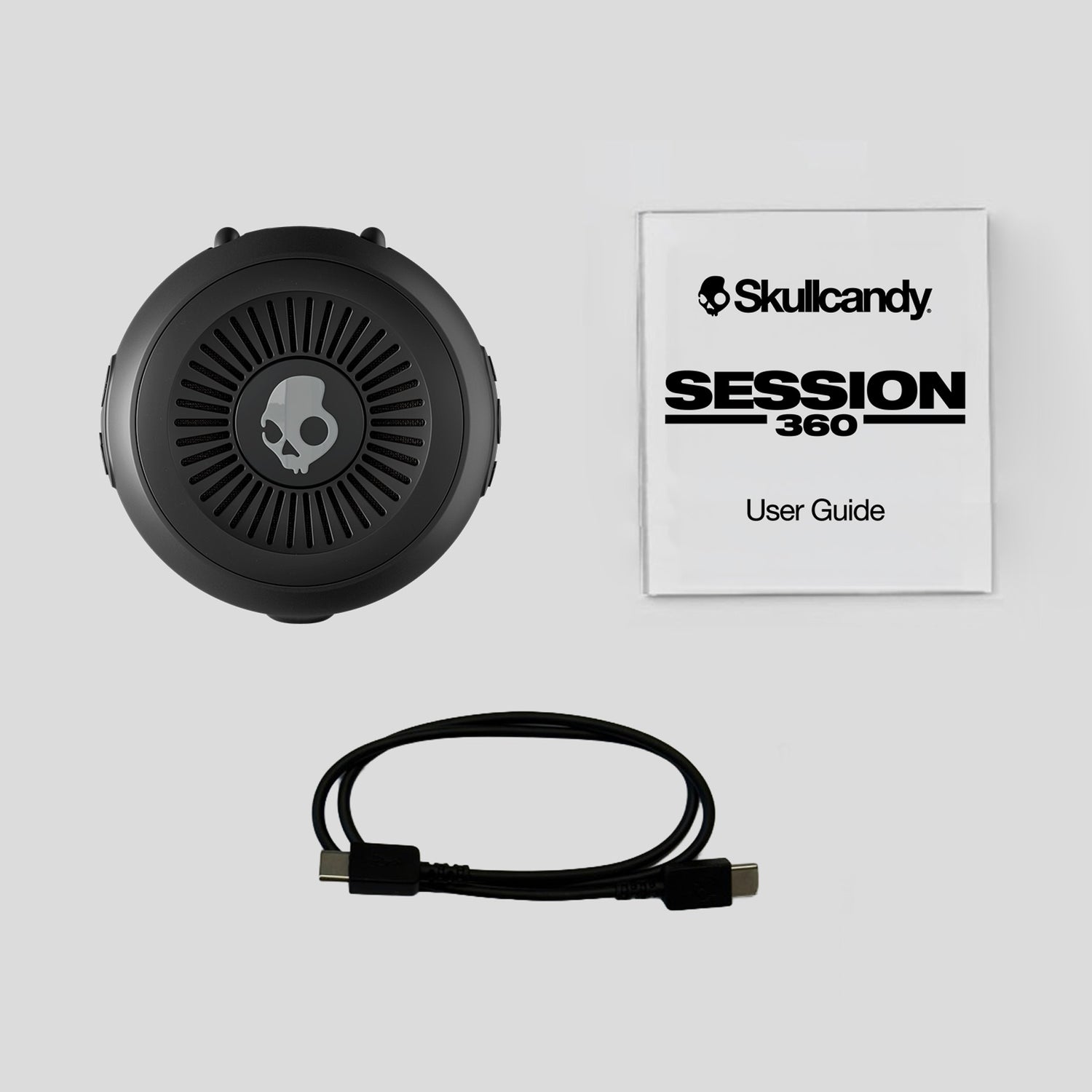 Skullcandy Session 360 headset with user guide on a light gray background | True Black