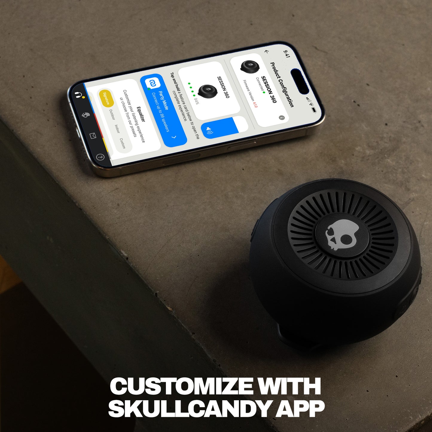Black speaker next to a smartphone displaying an app interface on a concrete surface. | True Black