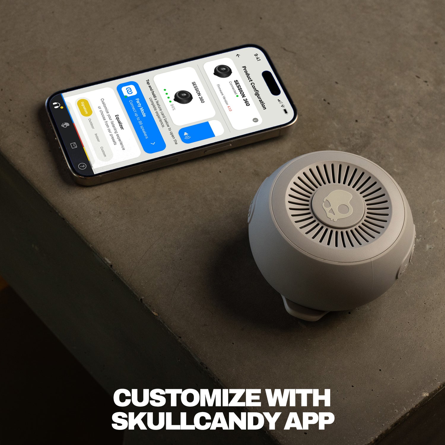 Smartphone displaying an app interface next to a speaker on a concrete surface with text 'Customize with Skullcandy App'. | Cement