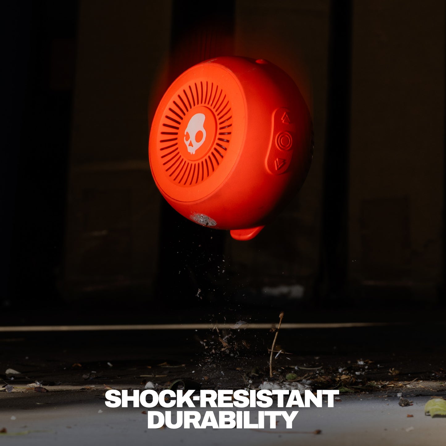 Orange shock-resistant speaker with durability text on a dark background | Plasma