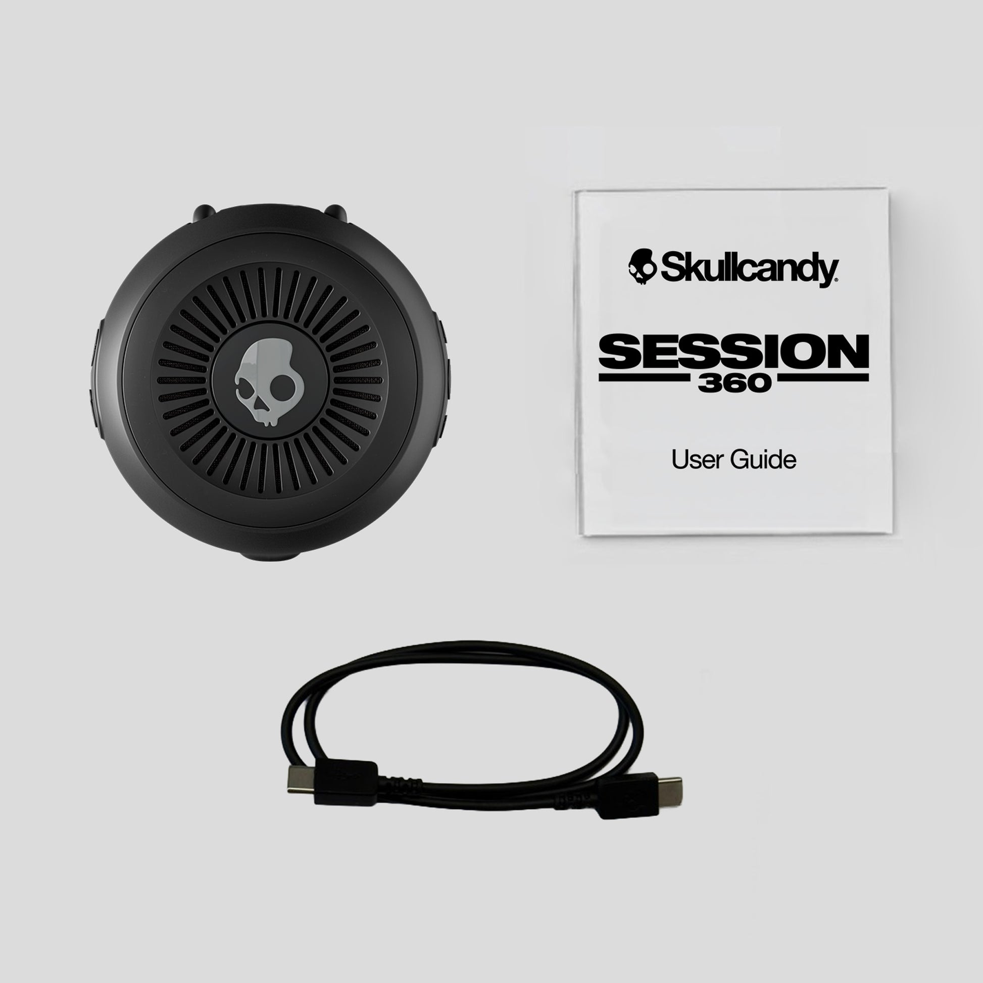 Skullcandy Session 360 headset with user guide on a light gray background | Primer