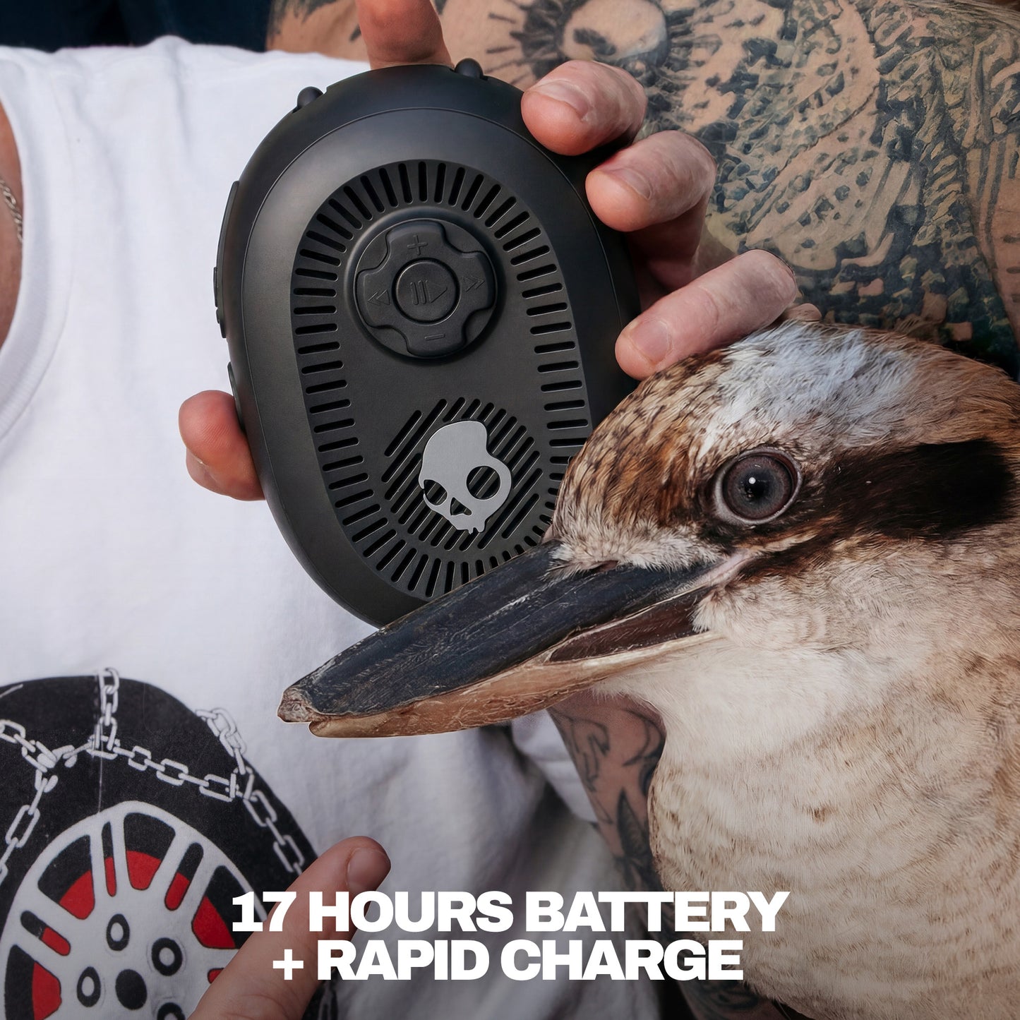 Person holding a black speaker with a bird close by, emphasizing battery life and rapid charge feature. | True Black