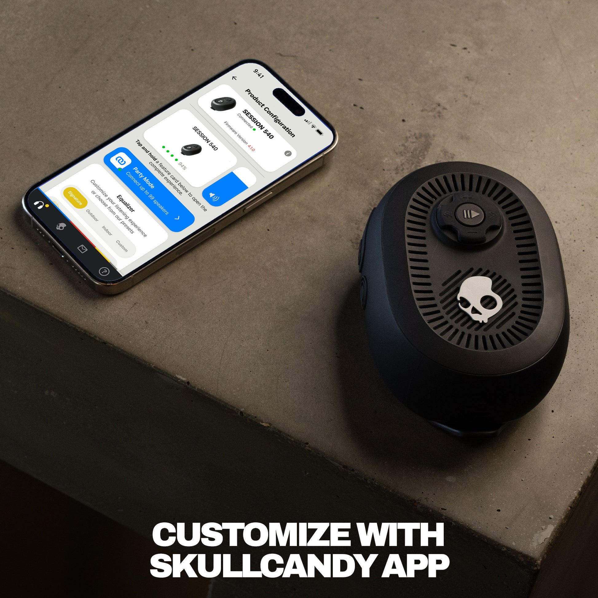 Black speaker next to a smartphone on a concrete surface with 'Customize with Skullcandy App' text. | True Black