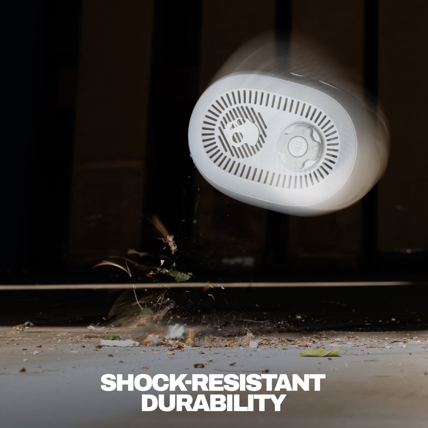 Close-up of speaker text 'Shock-Resistant Durability' on a dark background | Cement
